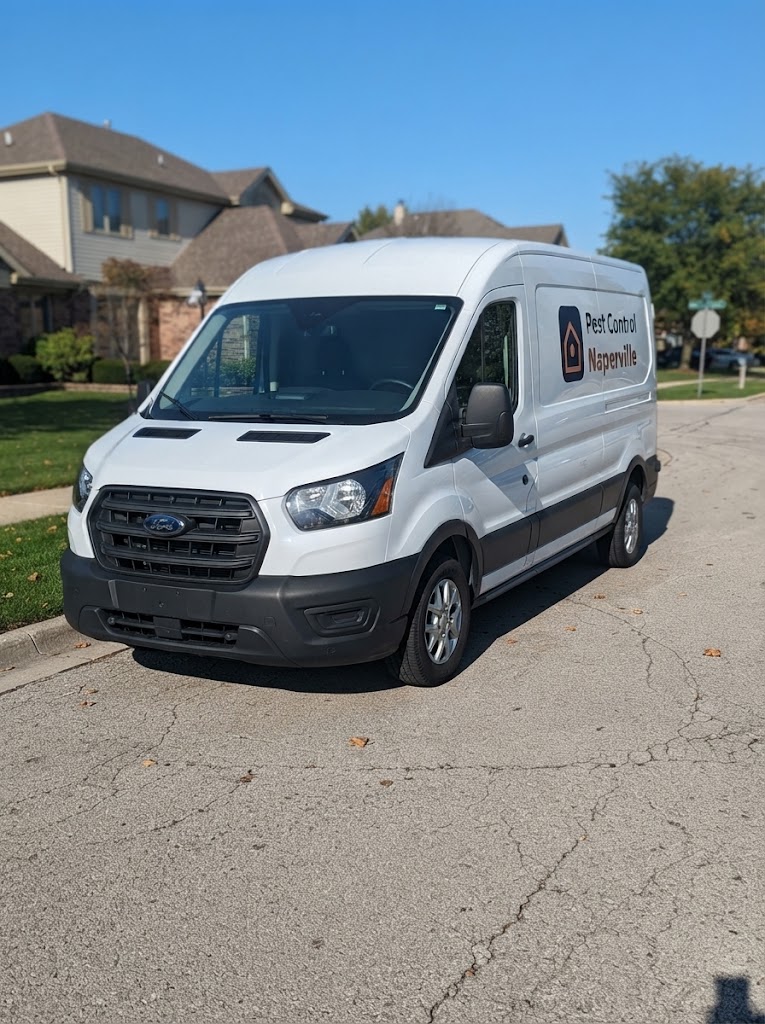 White Pest Control Naperville van parked near homes